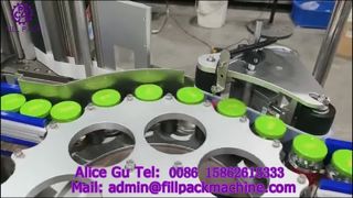 2129 دستگاه لیبل زن چرخشی خودکار برای بطری های شیشه ای درپوش سه پیچ با برچسب خود چسب